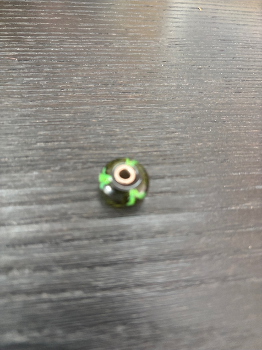Trollbead brown with green flower.
